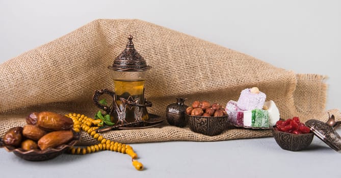 turkish delight with tea glass dates fruit. High resolution photo
