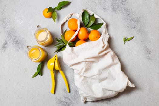 top view tote bag with oranges juice. High resolution photo