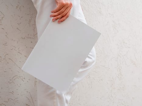 woman holding mock up magazine. High resolution photo