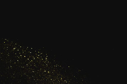 yellow sequins dark background. High resolution photo