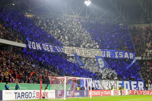 Loud support: From the Elbe to the Isar is written on a banner in the HSV fan curve at the match for the DFB Cup 2024-25,2nd round: SC Freiburg vs Hamburger SV
