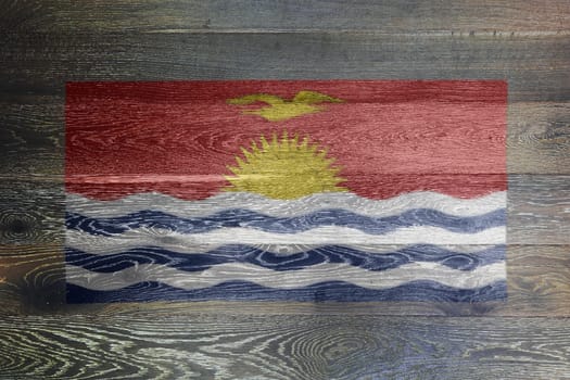 A Kiribati flag on rustic old wood surface background