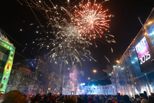 Crowds gather in the city streets to celebrate New Year with dazzling fireworks lighting up the night sky creating a festive atmosphere.