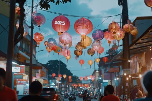 Lanterns hang above the street casting vibrant colors as people stroll. The atmosphere buzzes with excitement for the upcoming festival.