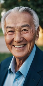 An elderly man wearing a light jacket and blue shirt smiles brightly, displaying happiness and contentment in a natural outdoor environment during the day. A resident of Kazakhstan. AI generated