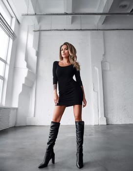 gorgeous young model woman dressed in little black dress with boots, AI generated image