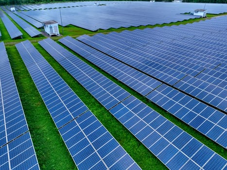 Aerial view of solar farm. Sustainable renewable energy and modern photovoltaic technology for eco-friendly electricity production. Solar power station. Green energy solutions. Solar panel technology.