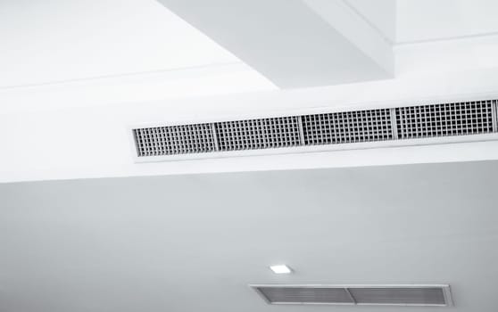 Air flow and ventilation system. Air Handling Units on ceiling walls for efficient cooling. Building ventilation. Air Handling Units and climate control systems. Ceiling-mounted ventilation units.