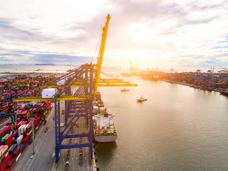 Logistics and transportation of container cargo ship at ship port. Container truck and crane bridge in shipyard. Import export and transport industry. Terminal port for export transport by ship.