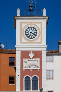 Rovinj, Croatia, Istria - September 29, 2023: Tower with city clock and relief of Venetian lion located on Marshal Tito Square