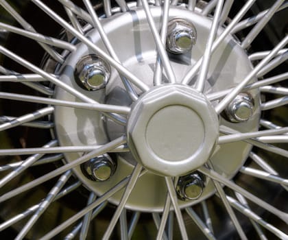 Vintage car wheel of an old-timer with silver spokes