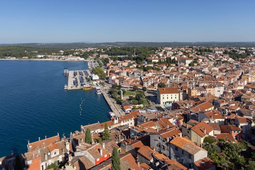 Rovinj  Croatia  Istria - September 29  2023: Aerial view from bell tower of Saint Euphemia Church of city and coast of Adriatic Sea. Typical red ceramic roof tile