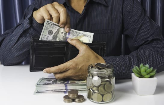 Businessman holding cash for financial income. Banknotes in hands. Hand holding out money.