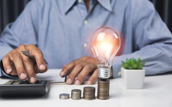 Business accounting with saving money with light bulb concept financial.