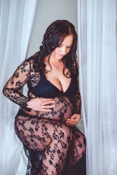 Maternity photo shoot captures a beautiful woman celebrating her pregnancy, showcasing confidence and intimacy.