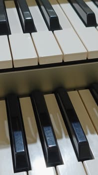 Close-up of an electronic organ in a cozy music room.