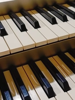 Close-up of an electronic organ in a cozy music room.