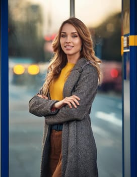 pretty young woman waiting for transport at bus stop, AI generated image