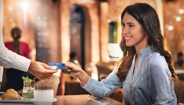 gorgeous young woman paying with credit card or debit card at restaurant, AI generated image