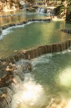 View onto the many pools, lagoons of the Kuang Si Falls, Waterfalls with its emerald green water, Luang Prabang, Laos 2023