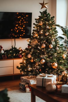 A stunning Christmas tree adorned with gold ornaments and twinkling lights stands in a warm living room filled with festive decorations.