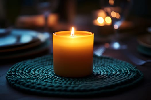 The soft glow of a candle illuminates a table beautifully set for an intimate dinner, creating a warm ambiance.