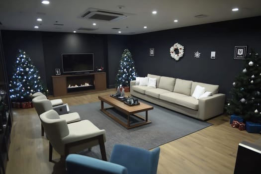 A modern living room features two decorated Christmas trees, holiday presents, and a comfortable seating arrangement, creating a festive atmosphere.