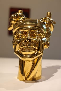 Venice, Italy - May 7 2024: Foreigners Everywhere 60th Venice Art Biennale in Venice. Gioia by Victor Fotso Nyie. Glazed ceremic and gold.