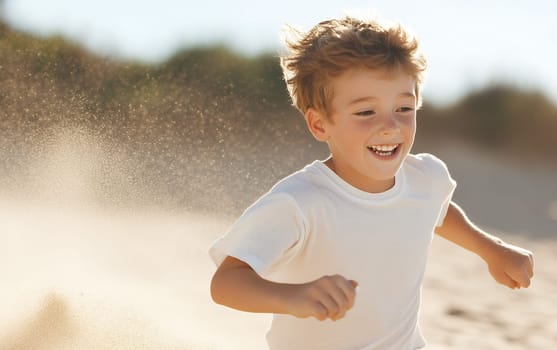 Joyful young boy running on a sandy beach, kicking up sand as he enjoys a sunny day.