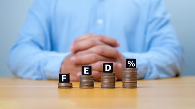 The Federal Reserve to control interest rates. FED concept. Wooden blocks FED. American economy and business. Federal Reserve Bank Interest rates rise policy.