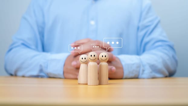 Wooden doll figure with communication and technology symbols, Social media and technology concept, Conversation exchange of ideas in an organization or in society, Joining a group listening.