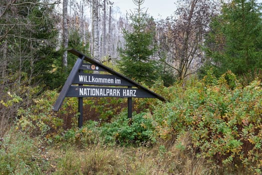 Sign with the German inscription willkommen im Nationalpark Harz in Schierke on the Brocken mountain. Translation: Welcome to the Harz National Park