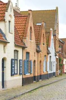 Typical historic houses in the old town of Bruges in Belgium Away from the usual tourist attractions in a side street
