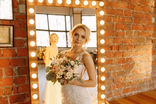 A stunning bride poses with her bouquet in a chic venue, capturing the essence of love and celebration