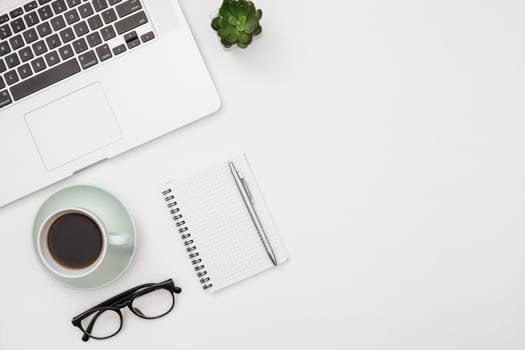 flat lay laptop mockup with notepad
