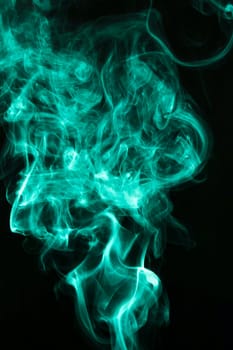 fluffy puffs green smoke fog black background. High resolution photo