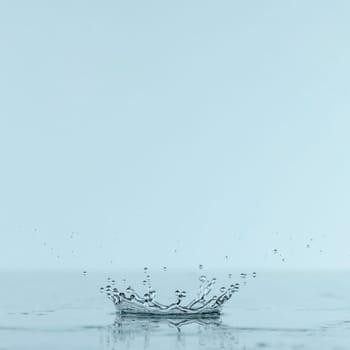front view splash water from drop with copy space. High resolution photo