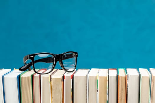 front view books with glasses. High resolution photo