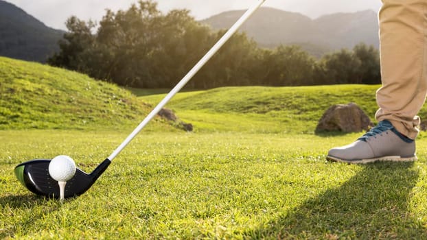 man practicing golf field. High resolution photo