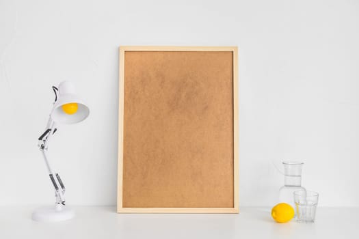 minimalistic workplace with cork board lemon. High resolution photo