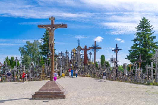 SIAULIAI, LITHUANIA, JUNE 17, 2024: The Hill of Crosses is a unique sacral site covered in 200,000 crosses of various shapes and sizes. It is a place of pilgrimage and prayer, visited by Pope John Paul II and many other believers.