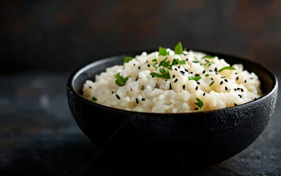A bowl of creamy risotto garnished with fresh herbs and black sesame seeds for a touch of elegance.