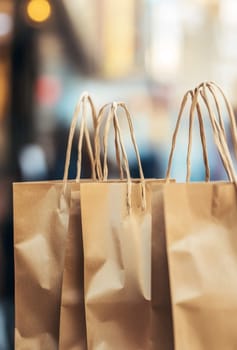 A closeup of brown paper shopping bags, capturing the texture and simplicity of eco-friendly packaging.