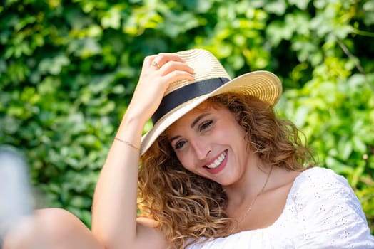 happy young woman with straw hat