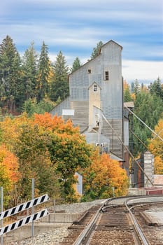 Railroad tracks lead to a vintage industrial building in Bonners Ferry, Idaho.