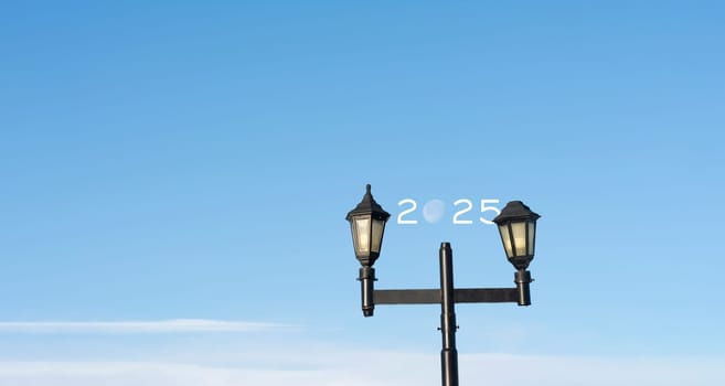 2025 text with moon inside outdoor lamppost - Happy new year concept