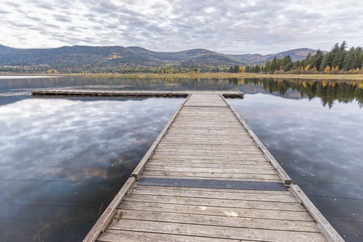 Looking out at the dockon the calm McArthur Lake in north Idaho.