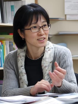 Female Asian Teacher educates children in the Class School