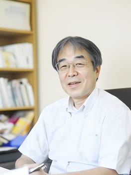 Male Asian Teacher teaching children in the Classroom School