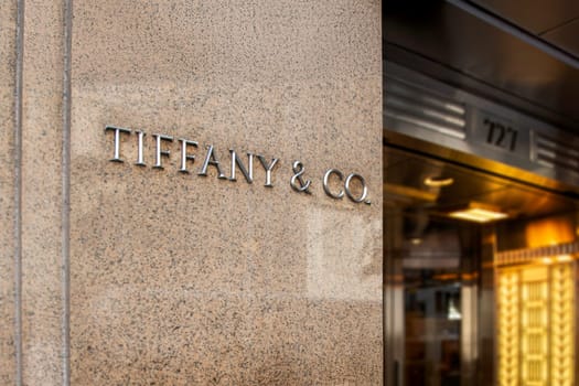 New York, US, Nov. 1, 2016  Close-up of the Tiffany and Co. logo on a stone wall outside the luxury brand’s storefront. Iconic symbol of elegance, luxury, and heritage.